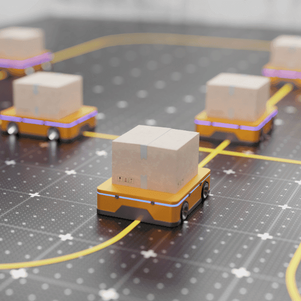 Automated guided vehicles carrying cartons along a marked warehouse floor